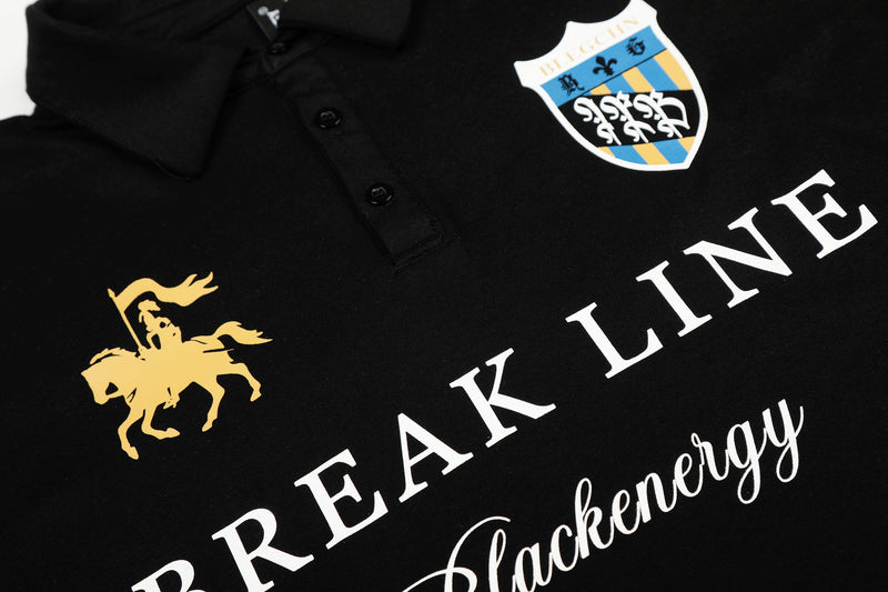 Close-up of black polo shirt front graphic with crest and horse rider print