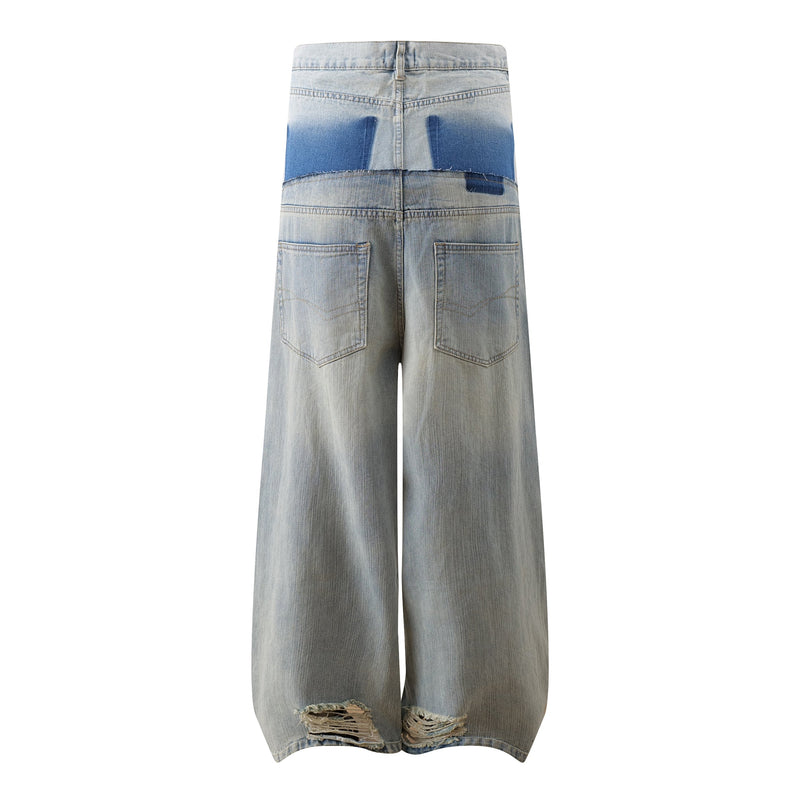 Back view of light two-tone washed wide-leg jeans with blue upper panel and frayed hems