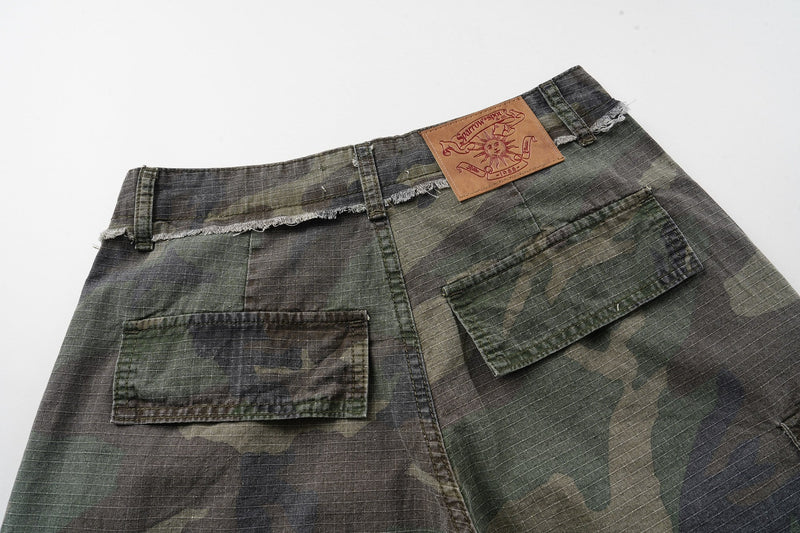 Back view of camouflage cargo shorts showing two rear flap pockets and logo patch