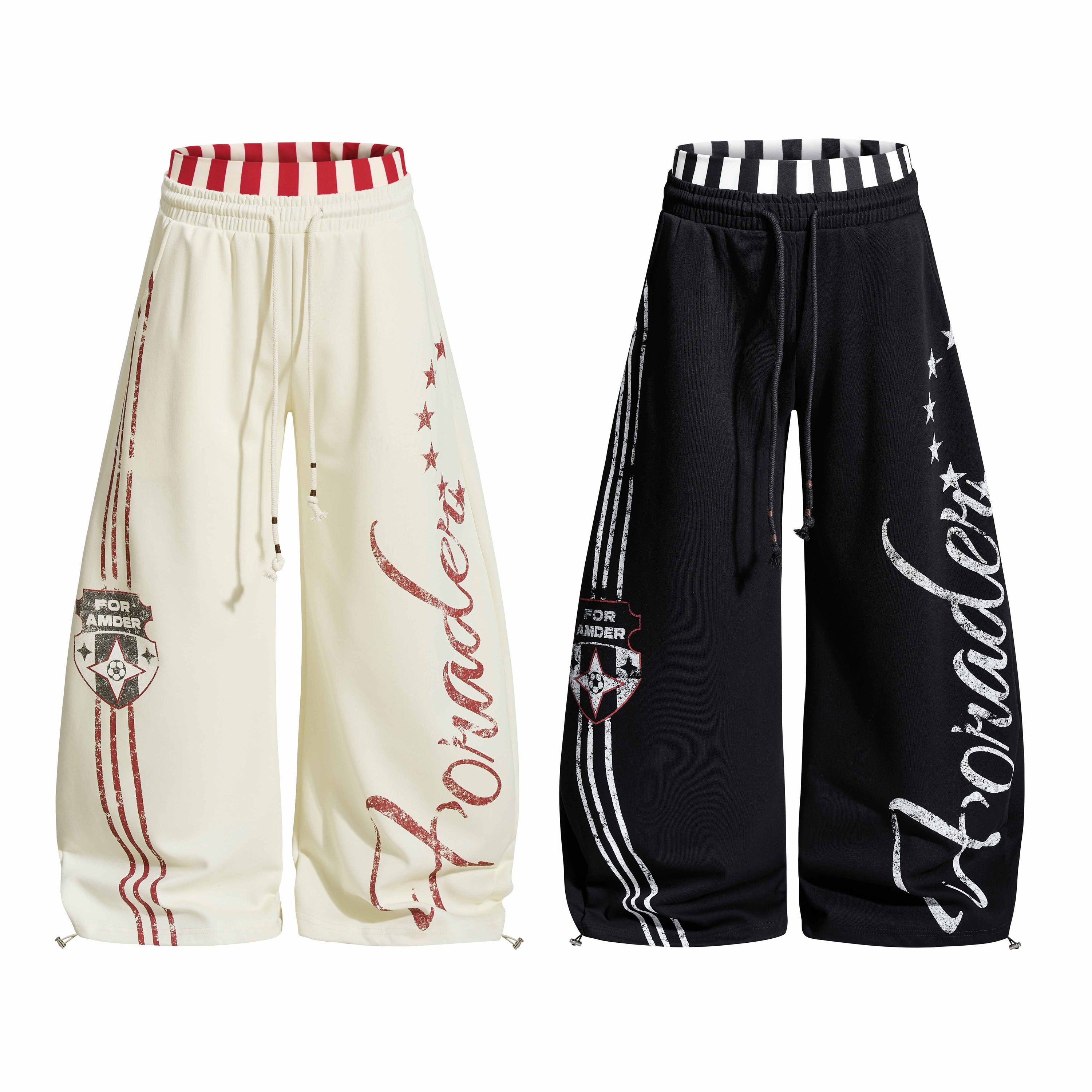 Cream wide-leg sweatpants with red varsity graphics, striped waistband, and distressed script lettering on white background