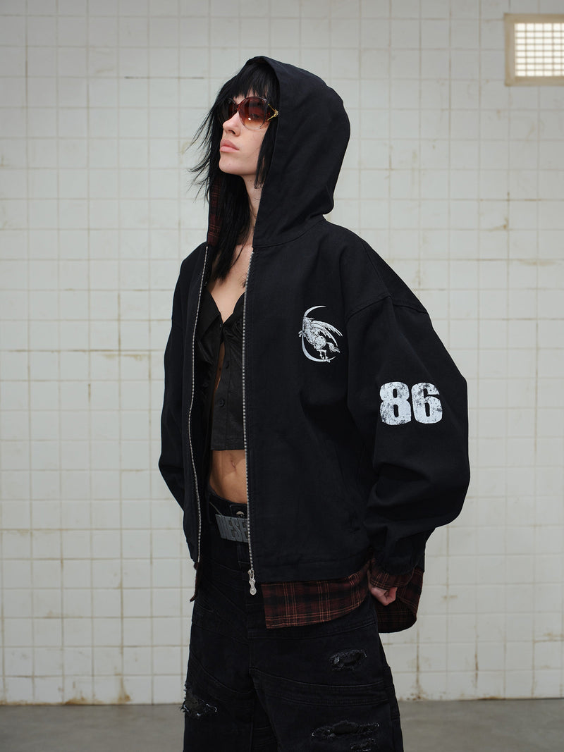 Side view of black hooded zip hoodie with white sleeve graphic and plaid lining