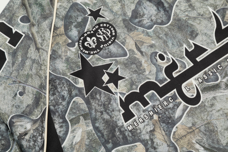 Close-up of upper chest graphic with star emblem and Mershier text on camouflage mesh jersey