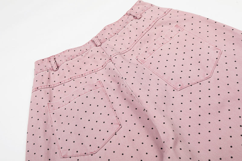 Close-up of pink polka dot pants showing side back pocket and seam detail