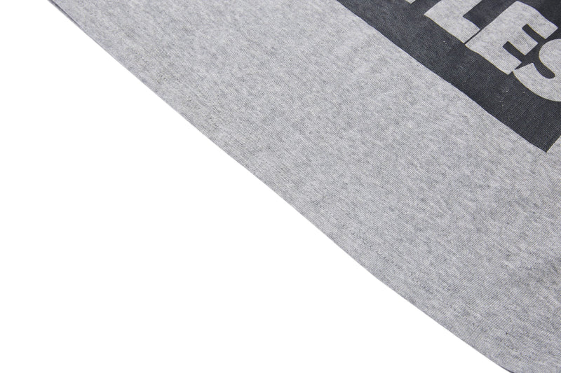Gray Beatles vintage graphic T-shirt sleeve with black contrast panel and bold retro print detail
