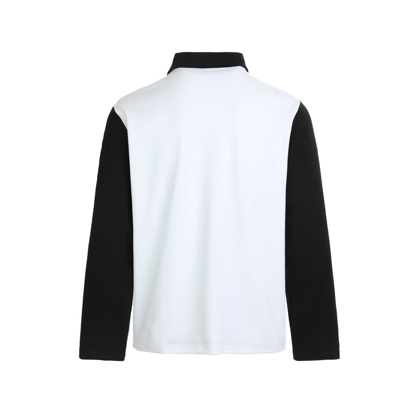 Back view of white long sleeve polo shirt with black sleeves and collar