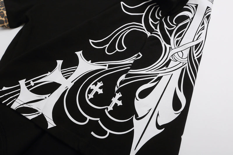Black polo shirt with bold white gothic cross graphic and leopard-print collar detail, Y2K streetwear style