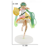 The Hatsune Miku Sleeping Beauty PVC Figure, 20cm tall, by the brand Hatsune Miku, features a colorful design with a white apron and yellow skirt. Holding a yellow object in one hand and standing on a round base, it&