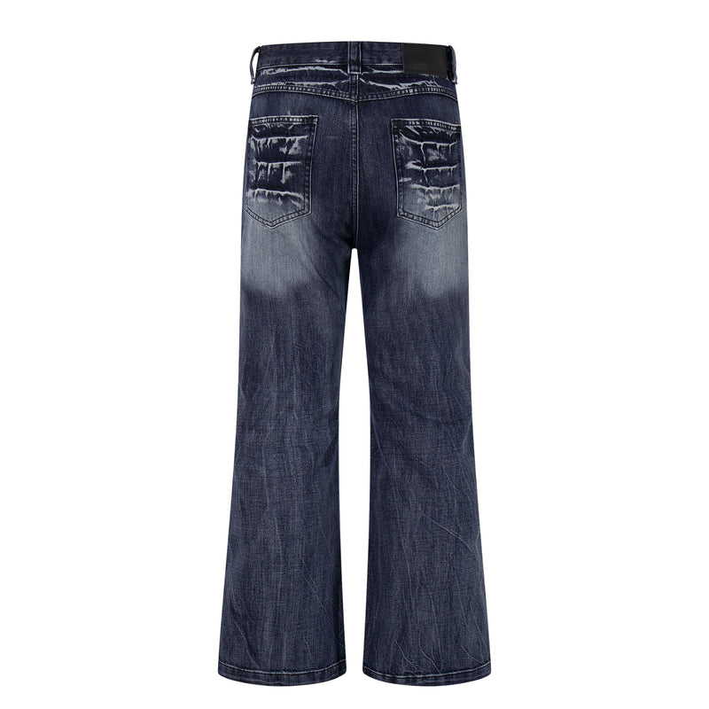 Back view of deep indigo wide-leg jeans with cracked-wash fading and patch back pockets