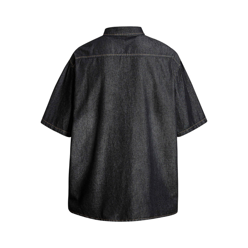 Dark denim short-sleeve button-up shirt shown from the back with a relaxed streetwear fit and contrast stitching
