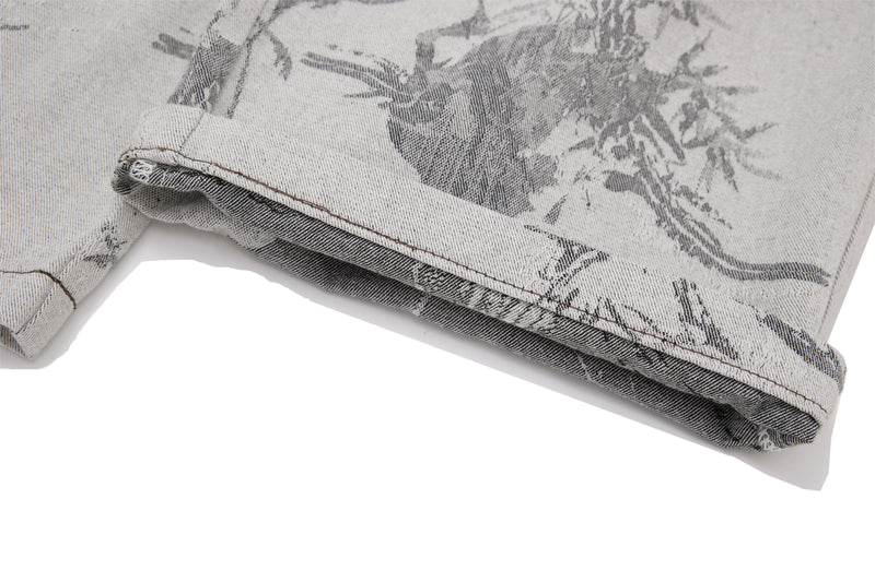 Close-up of the cuffed hem showing inside denim on gray brushstroke pants
