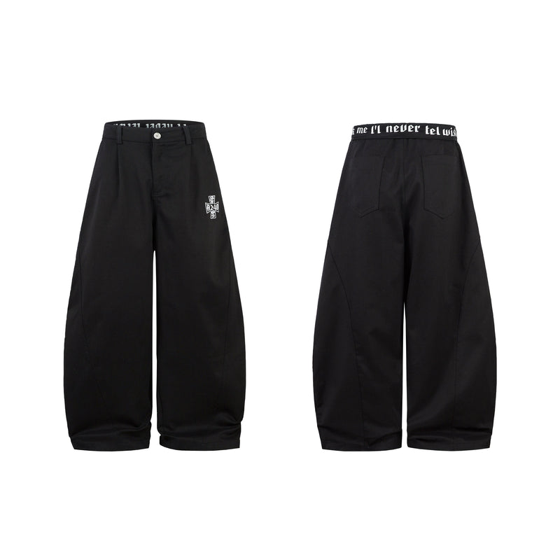 Black curved barrel-leg pants shown front and back, with wide legs and white graphic embroidery
