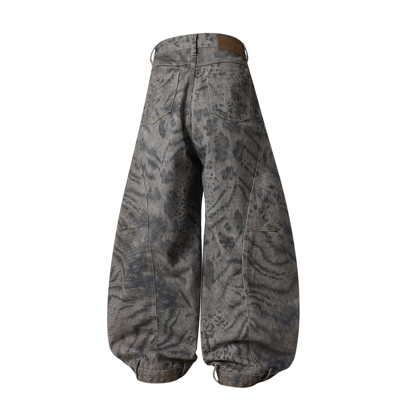 Back view of wide leg balloon jeans in dark mottled denim with patch pockets and leather label
