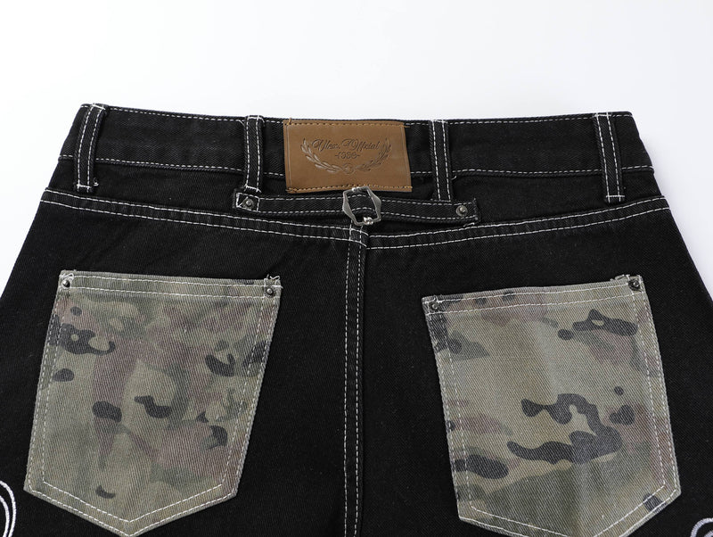 Back waistband view with tan label, belt loops, and camouflage back pockets