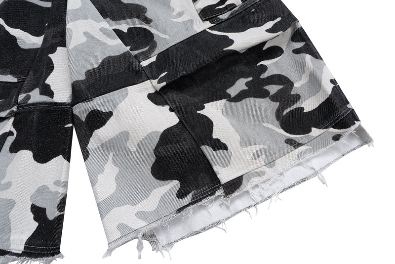 Close-up of frayed camo shorts hem on a wide leg