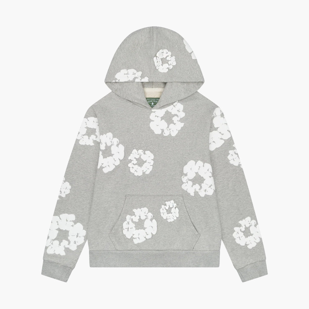 The Gray “Cotton Wreath” Denim Tears Hoodie features white floral prints inspired by the iconic Cotton Wreath pattern, offering streetwear style with a front pocket and hooded pullover design.