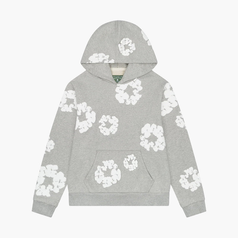 The Gray “Cotton Wreath” Denim Tears Hoodie features white floral prints inspired by the iconic Cotton Wreath pattern, offering streetwear style with a front pocket and hooded pullover design.