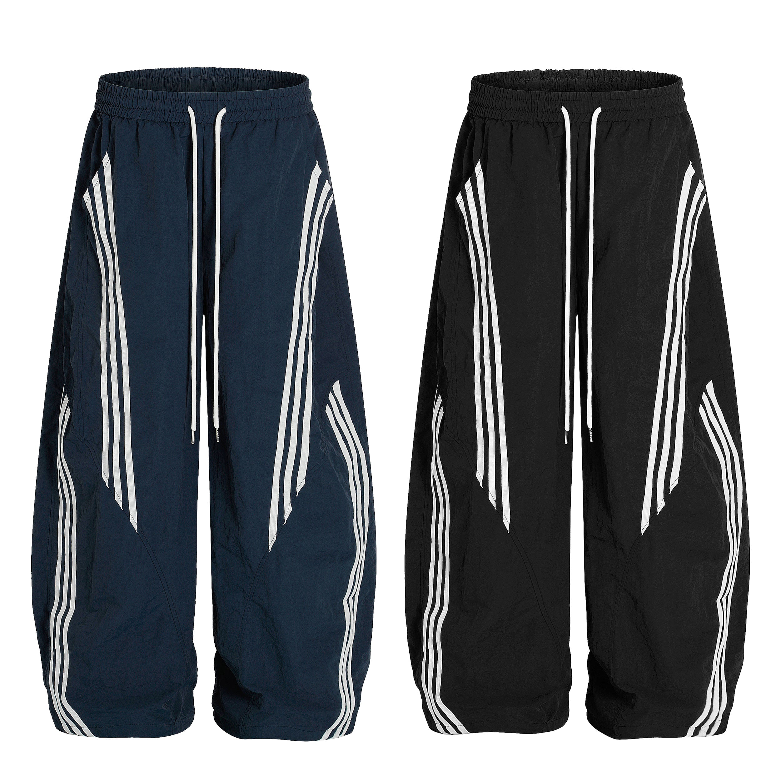 Omirad nylon wide-leg track pants in navy blue and black with white angular multi-stripe paneling and drawstring waist