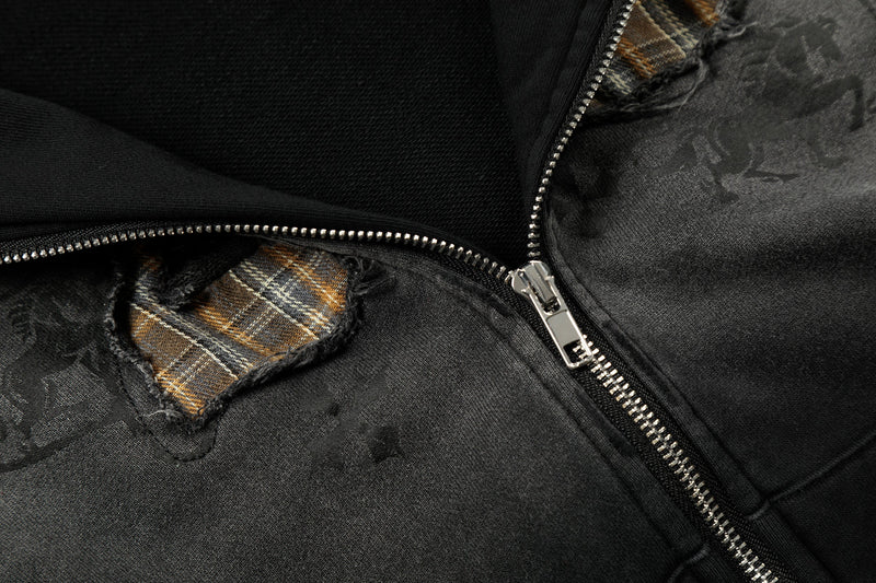 Close-up of black hoodie front zipper and plaid number 23 appliqué