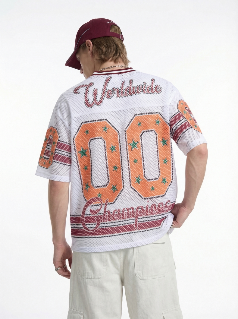 White mesh jersey T-shirt with Worldwide 00 Champions lettering and retro streetwear graphics, worn with cream pants and maroon cap