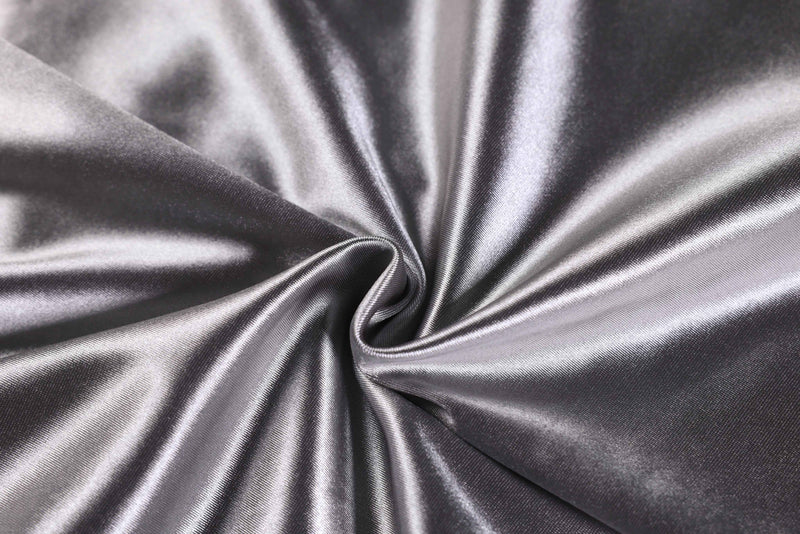 Shiny metallic silver fabric with a smooth, draped texture for an oversized varsity jersey tee
