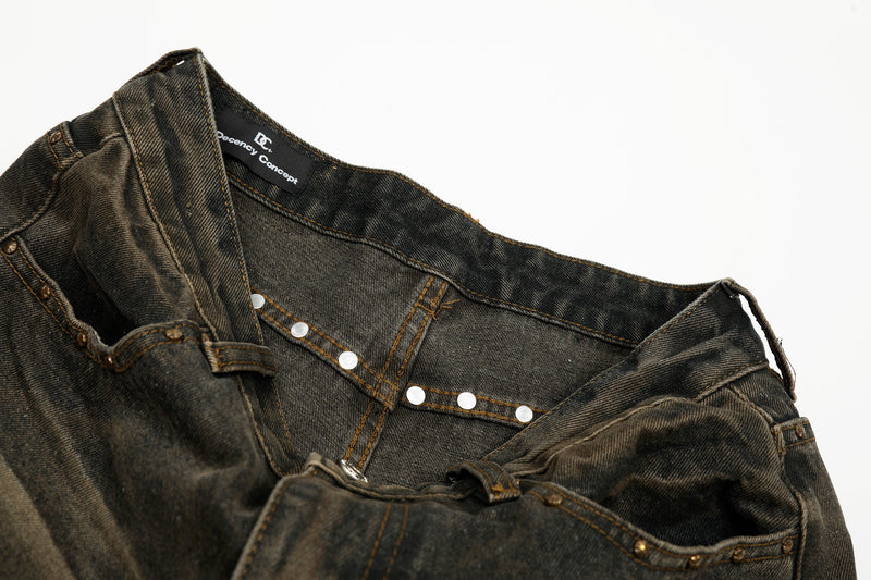 Waistband interior view of jeans with branded black label and metal rivets