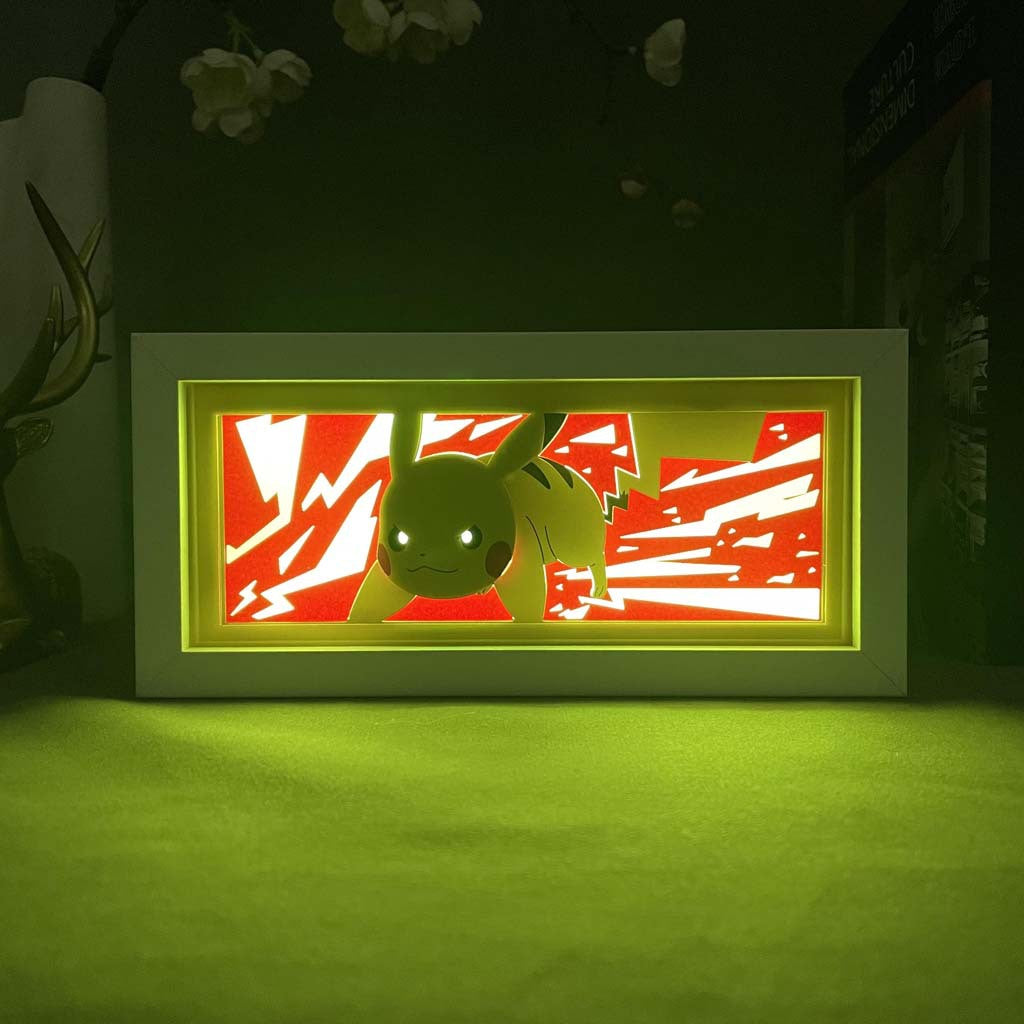 The Pikachu 3D LED Light Box by Pokémon features a vibrant, green-illuminated Pikachu against a red and white lightning-themed backdrop. Housed in a rectangular frame on a green base, it is ideal for any Pokémon collectible enthusiast.