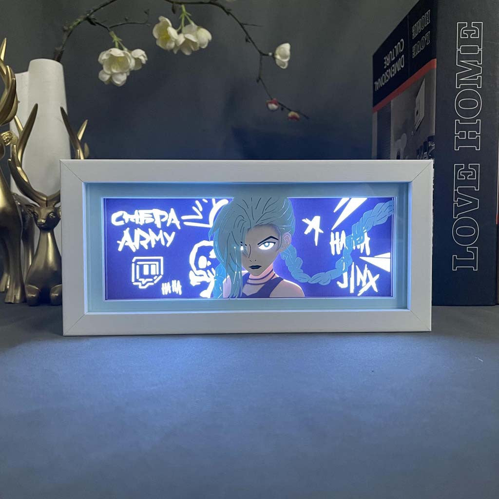 The Seakoff Jinx LED 3D Light Box – Arcane Champion Design features a blue-haired animated character with graffiti-style text in a rectangular frame. Ideal as a table accent, it adds flair alongside decor and books.