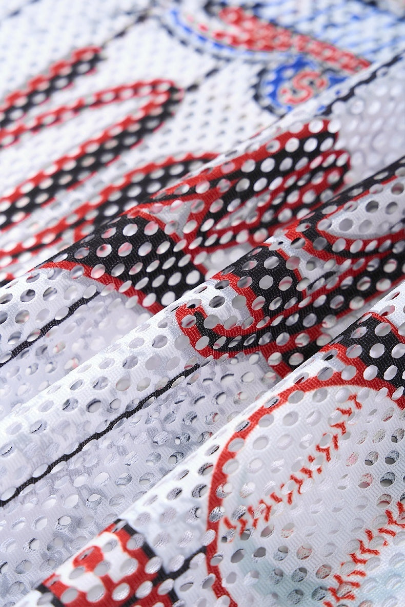 Close-up of white mesh jersey fabric with red and black pinstripe graphics and perforated texture