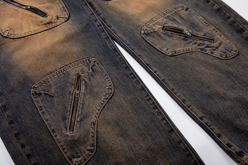 Diagonal close-up of both leg zip cargo pockets on sand-fade utility jeans