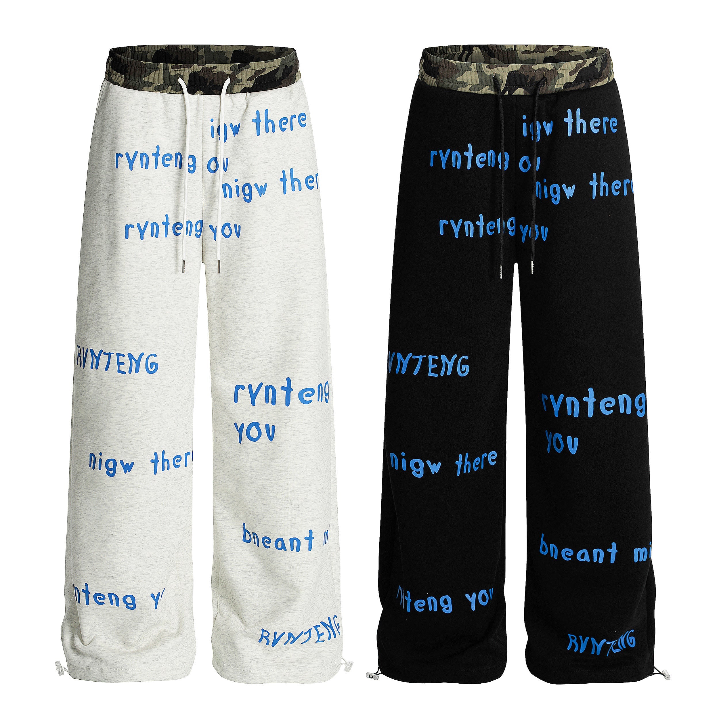 Grey and black wide-leg sweatpants with camo waistband and blue all-over text graphics, front view