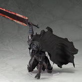 The Berserk Guts Berserker Brand Marked Action Figure features a kneeling knight in black armor with a large, bloodstained sword. This fully poseable PVC statue includes a flowing black cape set against a marbled gray background.