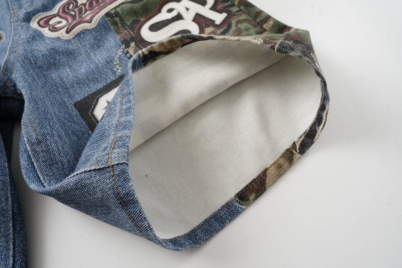 Close-up of rolled leg opening showing white inner lining and denim-camo hem