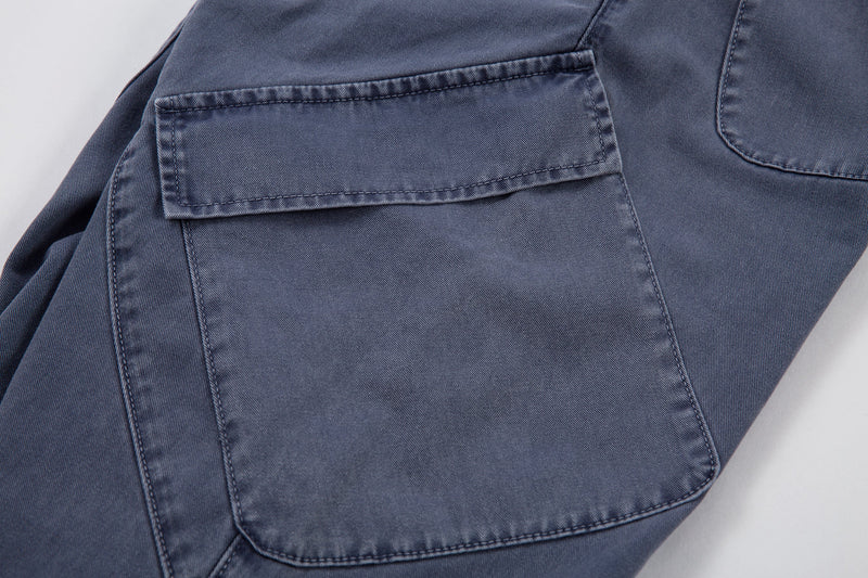 Close-up of back patch pocket on blue denim pants
