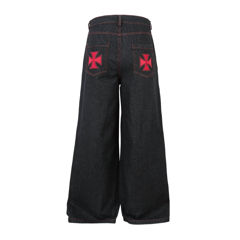 Back view of black wide-leg jeans with red stitching and red cross patches on pockets