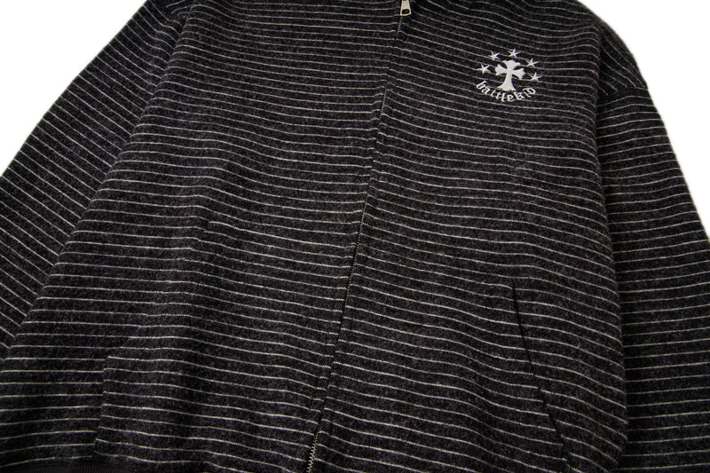 Front upper view of black striped knit zip hoodie with chest logo and zipper