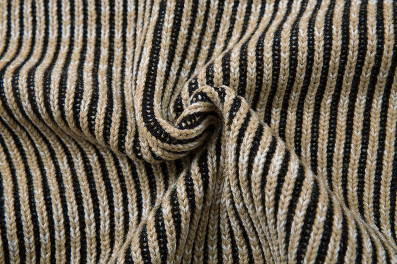 Close-up of the ribbed knit sleeve detail on the striped jacket