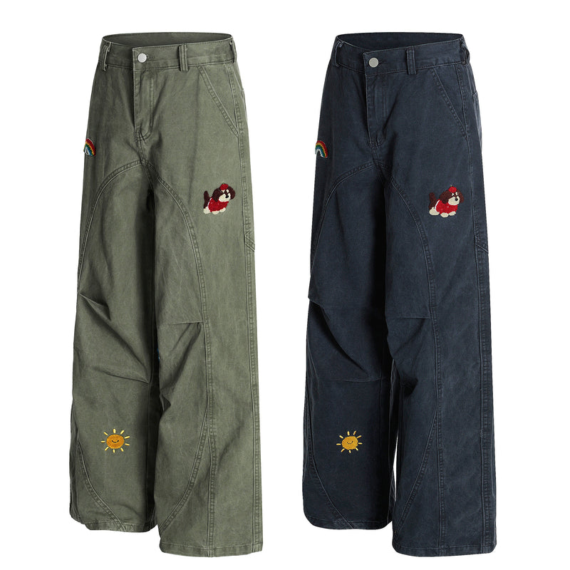 Olive and navy wide-leg pants with rainbow, dog, sun, music note and apple embroidery, front view