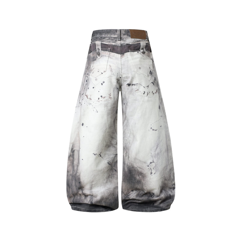 Back view of wide-leg jeans with abstract washed denim and brown logo patch