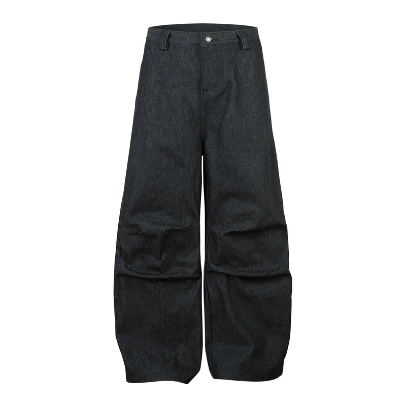Dark denim wide-leg pants shown front view with structured pleats and folded hems