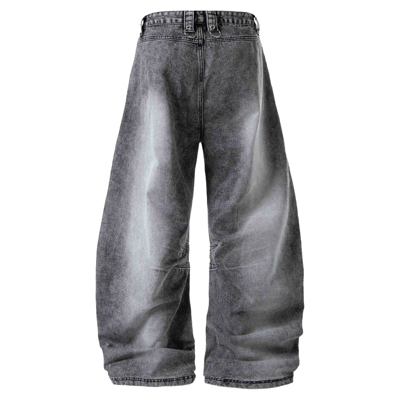 Back view of gray wide-leg denim pants with faded wash and subtle distressing