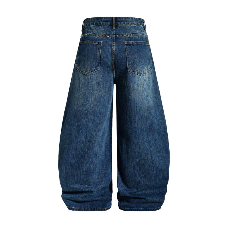 Back view of blue wide-leg denim jeans with studded waistband and patch pockets