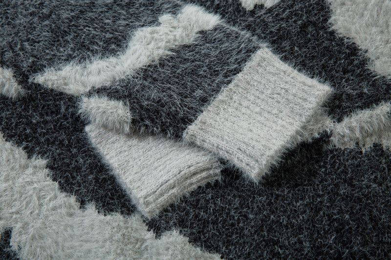 Close-up of black and white zebra print fluffy knit texture on the sweater