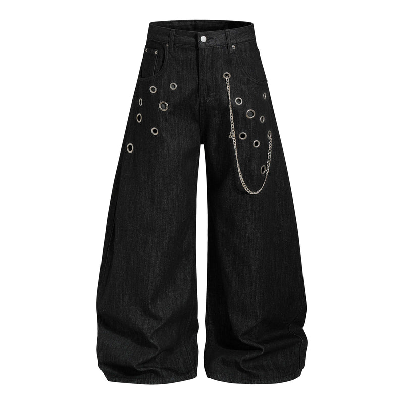 Wide-leg black denim pants with eyelets, hanging silver chain, and front view