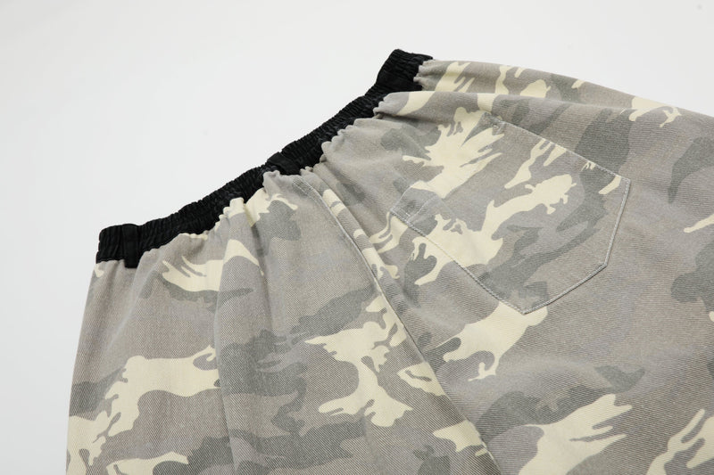 Close-up of back waistband and rear pocket on gray camo wide-leg jorts