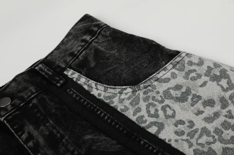 Close-up of black and leopard denim waistband edge and seam