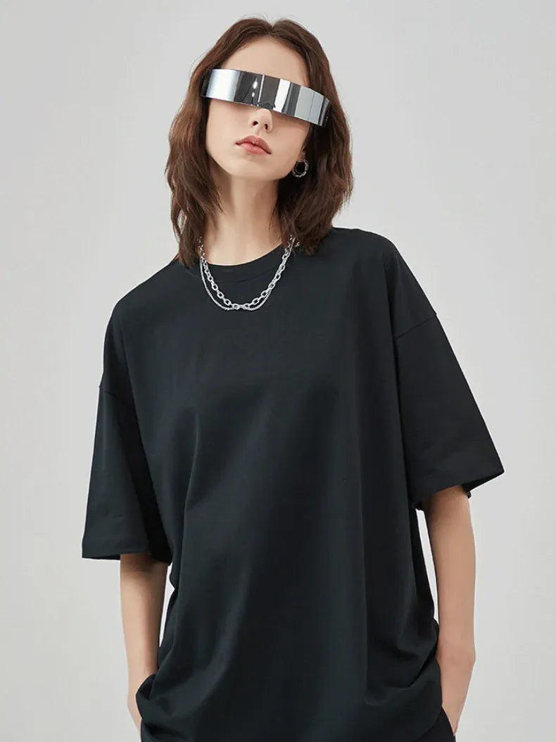 Person wearing a Custom Anime Character Black T-Shirt - Personalized 230GSM 100% Cotton Tee, paired with a silver chain necklace and large reflective visor sunglasses, standing against a plain light background.