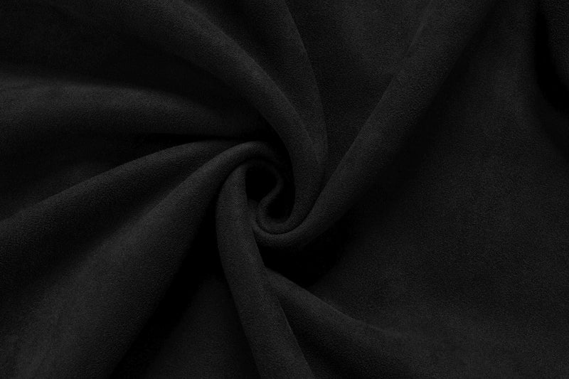 Close-up of black suede fabric showing soft textured folds