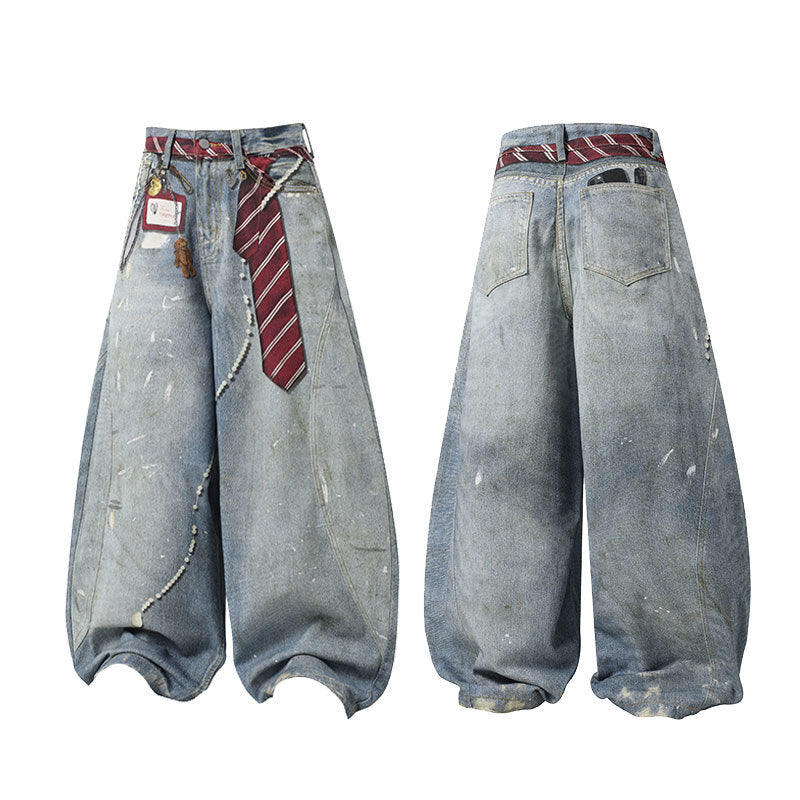 Front and back view of distressed washed barrel leg jeans with red striped tie belt and metal keychain accents