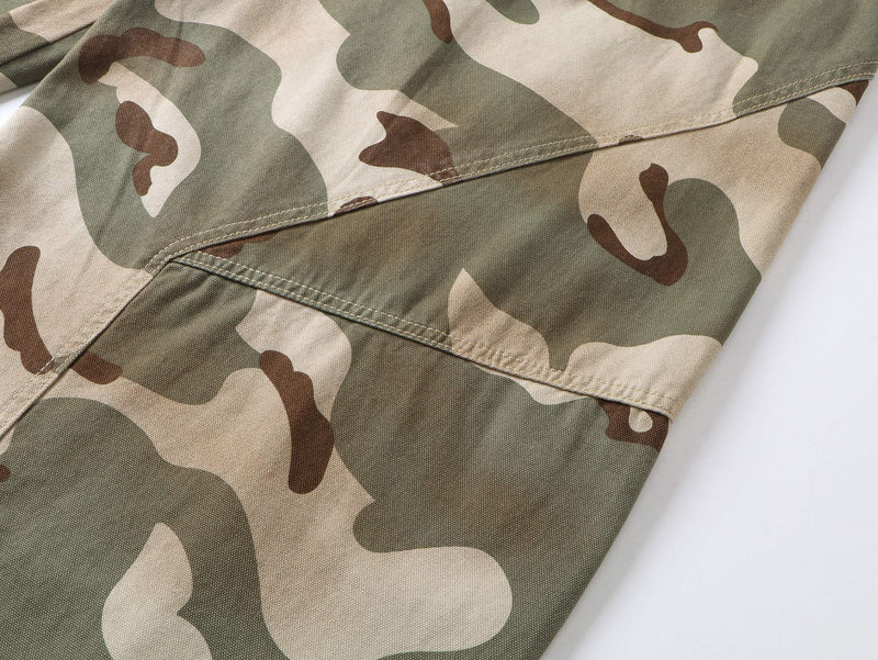 Close-up of camouflage pants side cargo-style pocket and seam detail
