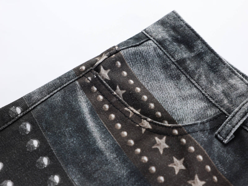 Close-up of upper side seam on black jeans with star-studded belt print